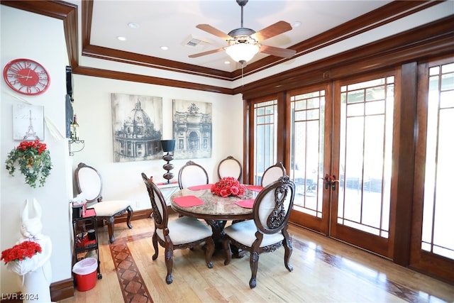 dining room featuring ceiling fan, light hardwood / wood-style flooring, french doors, and crown molding