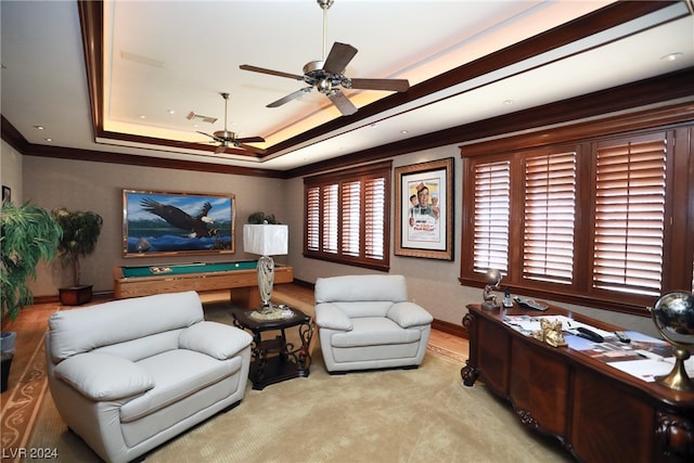 living room with pool table, ornamental molding, ceiling fan, and a tray ceiling