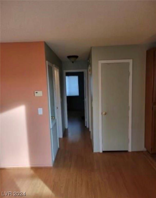 corridor featuring light hardwood / wood-style floors