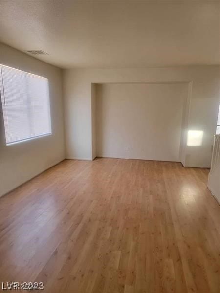 unfurnished room with light hardwood / wood-style floors