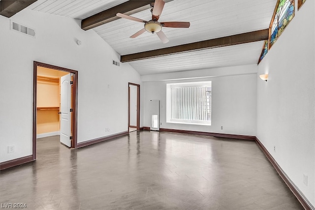 spare room with ceiling fan and lofted ceiling with beams