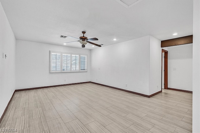 spare room featuring ceiling fan