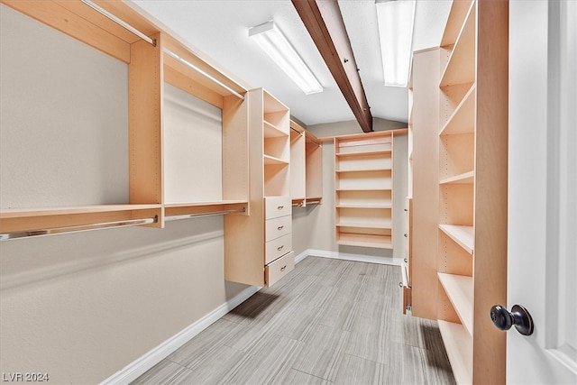 spacious closet featuring light tile floors