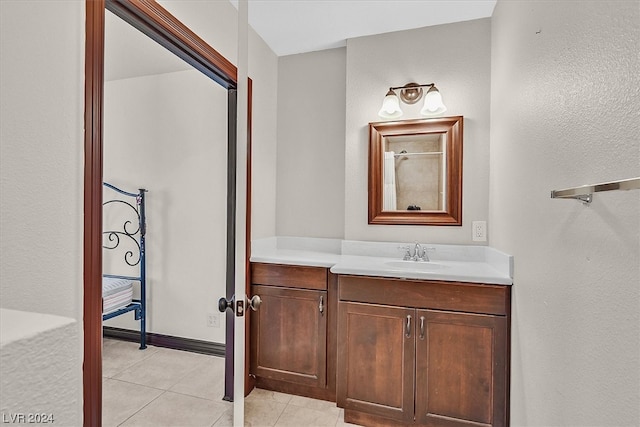 bathroom with tile floors and vanity