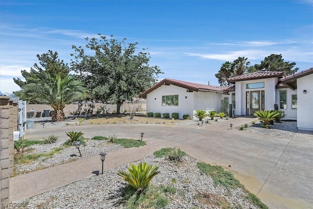 mediterranean / spanish home with french doors