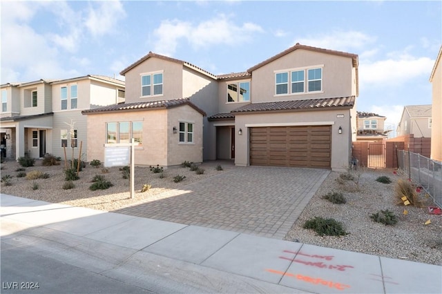 mediterranean / spanish-style house featuring a garage