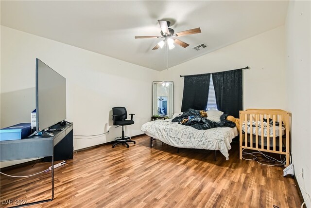 5717 Wizard Wand St, North Las Vegas, NV 89031 - bedroom with wood finished floors, lofted ceiling, ceiling fan, and a desk