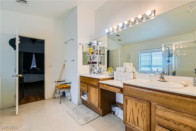 bathroom featuring walk in shower and vanity