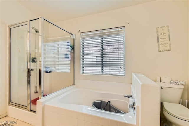 5717 Wizard Wand St, North Las Vegas, NV 89031 - full bathroom featuring a bath, a stall shower, and toilet