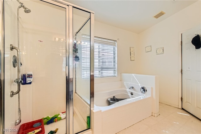 5717 Wizard Wand St, North Las Vegas, NV 89031 - bathroom with a shower stall, a garden tub, and tile patterned flooring