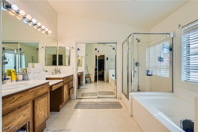 5717 Wizard Wand St, North Las Vegas, NV 89031 - full bath with a stall shower, vanity, a garden tub, healthy amount of natural light, and lofted ceiling