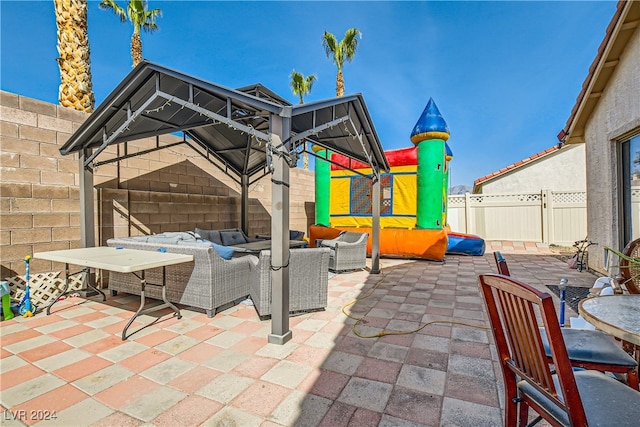 5717 Wizard Wand St, North Las Vegas, NV 89031 - fenced backyard with outdoor lounge area and a patio