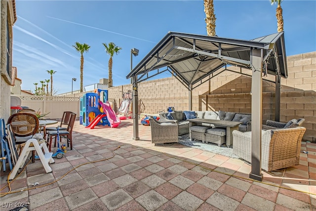 5717 Wizard Wand St, North Las Vegas, NV 89031 - fenced backyard featuring an outdoor living space and a patio area