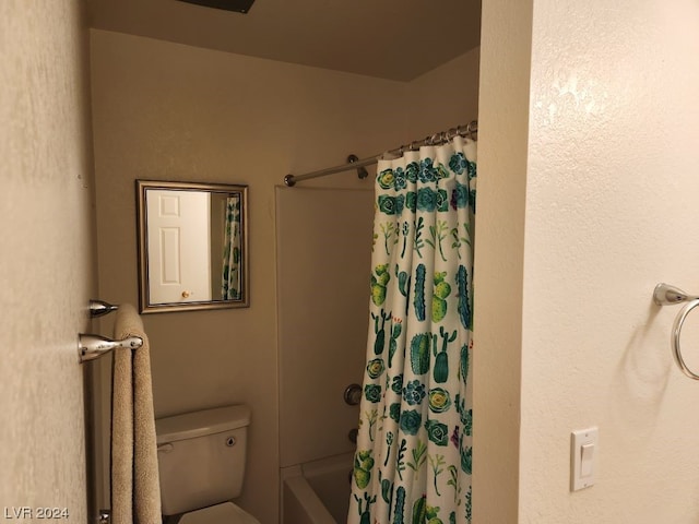 bathroom with toilet and shower / tub combo with curtain