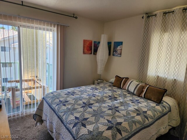 bedroom with dark colored carpet