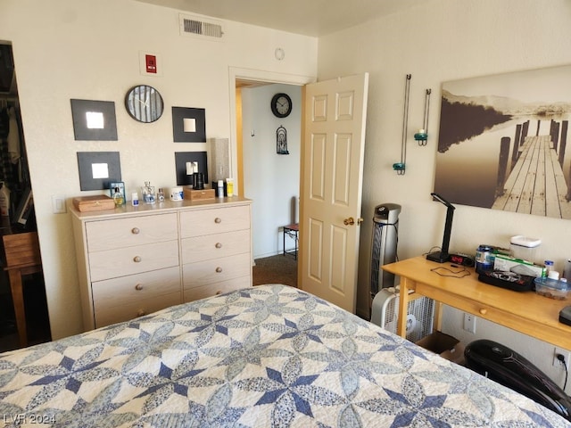 bedroom featuring dark colored carpet