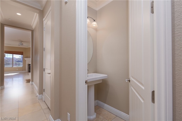 bathroom with ceiling fan, crown molding, tile flooring, and sink