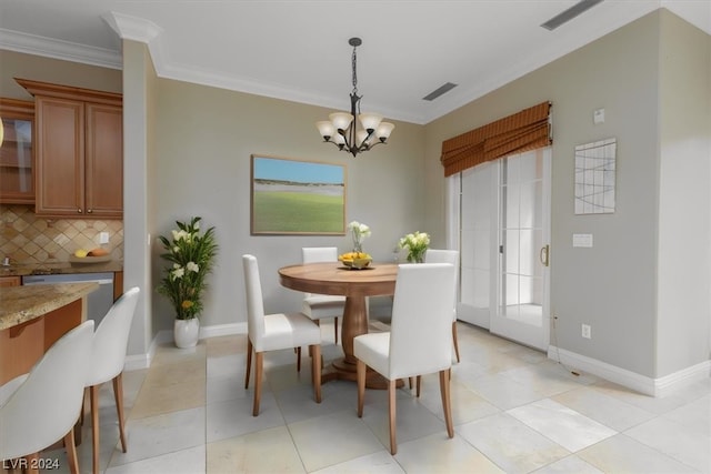 dining area featuring ornamental molding, light tile floors, and an inviting chandelier