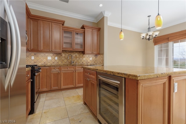 kitchen featuring an inviting chandelier, pendant lighting, a kitchen island, beverage cooler, and stainless steel fridge with ice dispenser