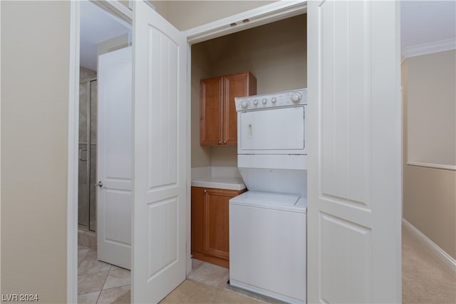 interior space with stacked washing maching and dryer