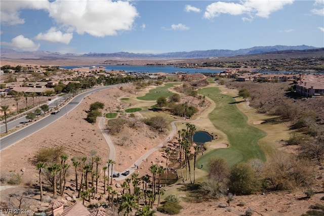 birds eye view of property with a water and mountain view