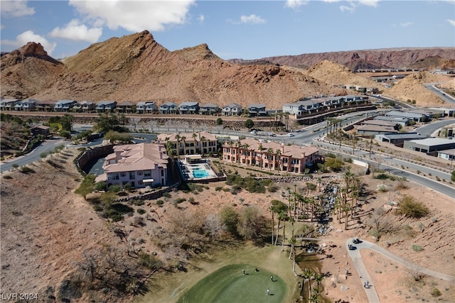 birds eye view of property featuring a mountain view