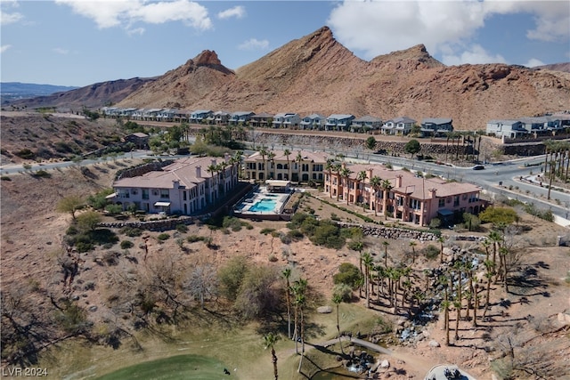 birds eye view of property featuring a mountain view