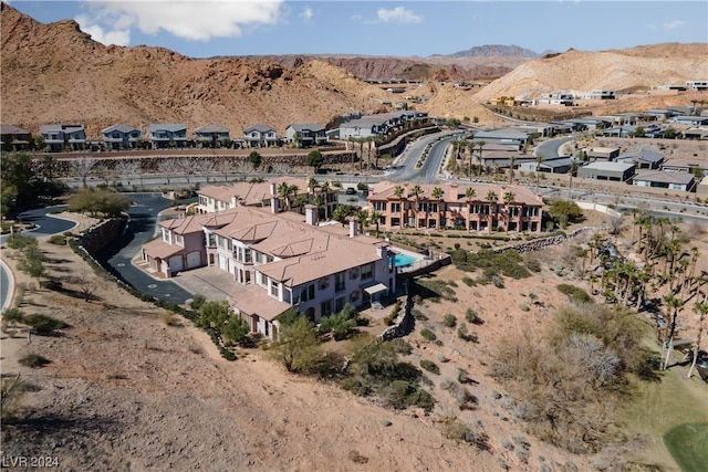 birds eye view of property featuring a mountain view