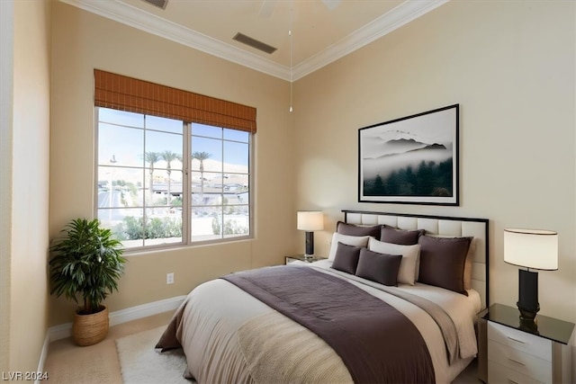 carpeted bedroom with crown molding and ceiling fan