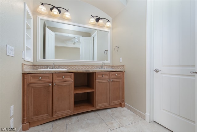 bathroom with ceiling fan, tile flooring, and dual vanity