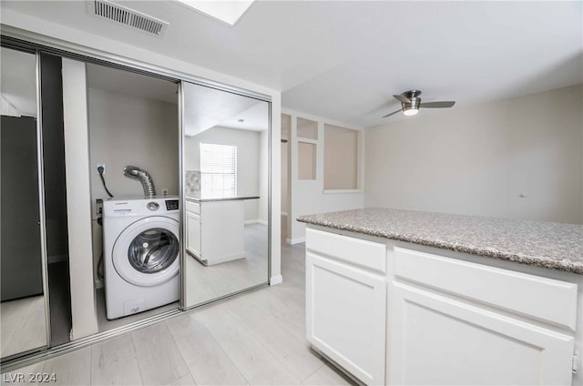 washroom with ceiling fan, light hardwood / wood-style floors, and washer / clothes dryer