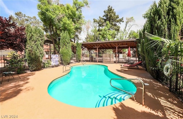 view of pool with a patio area and a gazebo