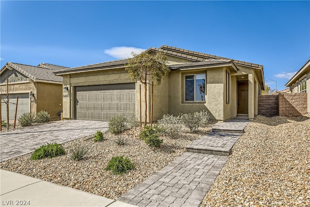 view of front of property with a garage