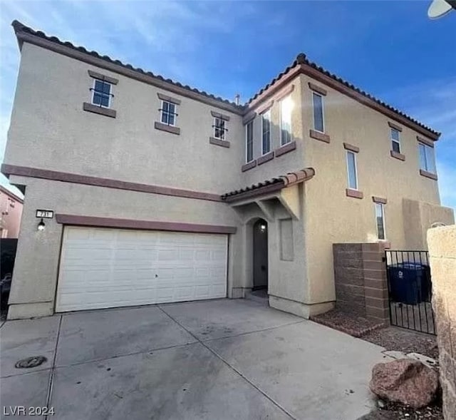 rear view of property with a garage