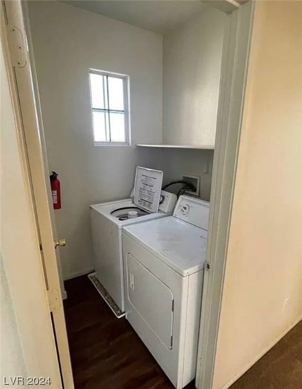 laundry area featuring hookup for a washing machine, dark hardwood / wood-style floors, and washer and clothes dryer