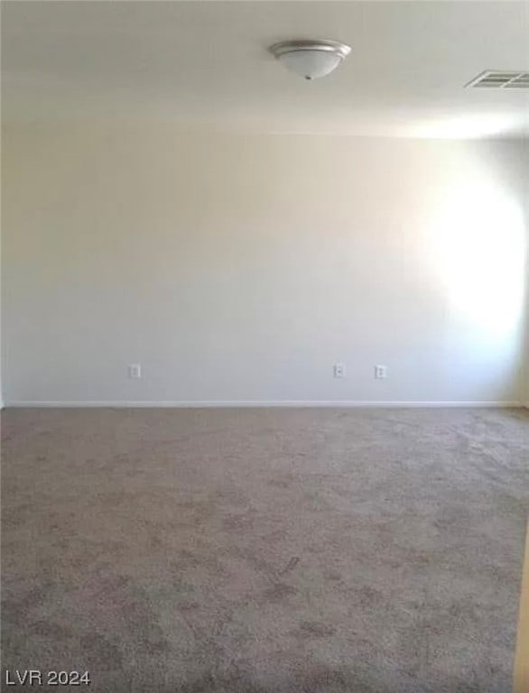 unfurnished room with carpet