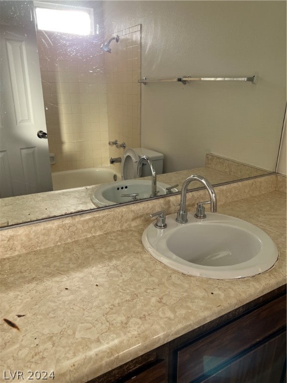 bathroom featuring shower / bathing tub combination and vanity