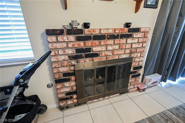 room details with tile floors, ceiling fan, and a fireplace