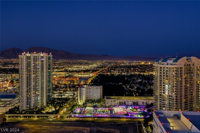 property's view of city featuring a mountain view