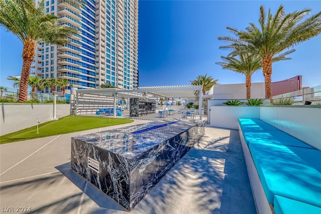 view of swimming pool featuring a pergola and a patio