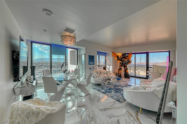 living room with light tile flooring and a chandelier