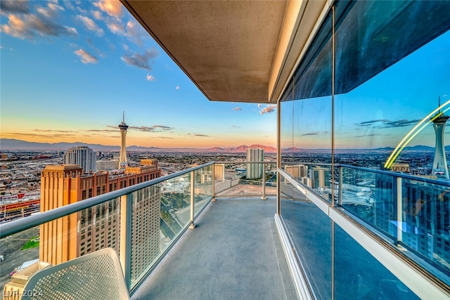 view of balcony at dusk