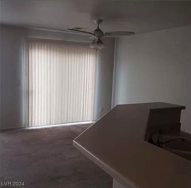 interior space featuring ceiling fan