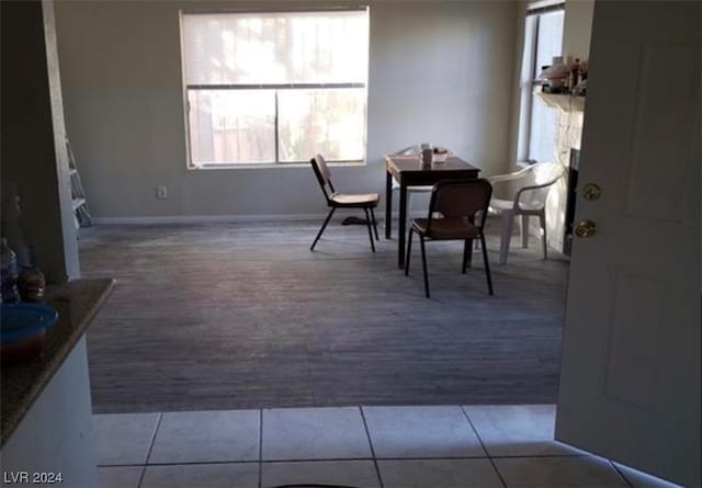 interior space featuring a healthy amount of sunlight and light tile flooring