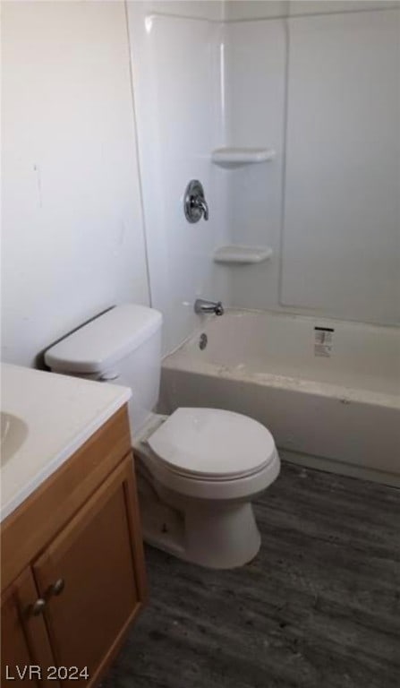 full bathroom featuring toilet, shower / washtub combination, vanity, and hardwood / wood-style floors