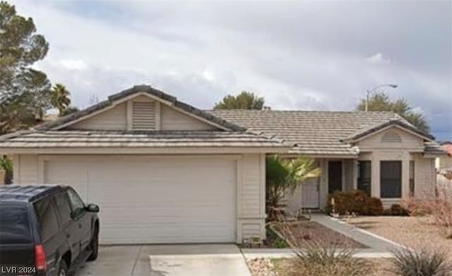 ranch-style home with a garage