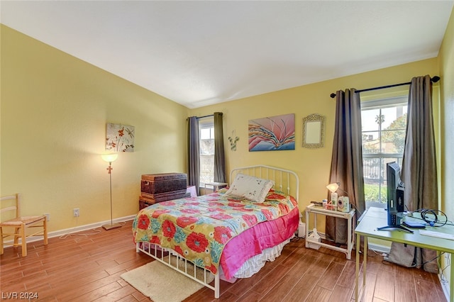 bedroom featuring access to outside and wood-type flooring