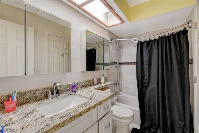 full bathroom featuring shower / bath combination with curtain, toilet, and vanity