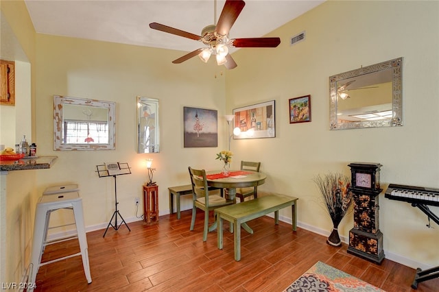 dining space featuring wood-type flooring and ceiling fan