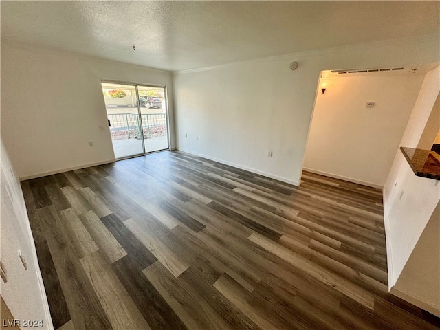 unfurnished room featuring dark wood-type flooring